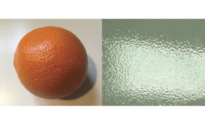 Orange showing the Orange Peel Effect on a car's paint right next to it